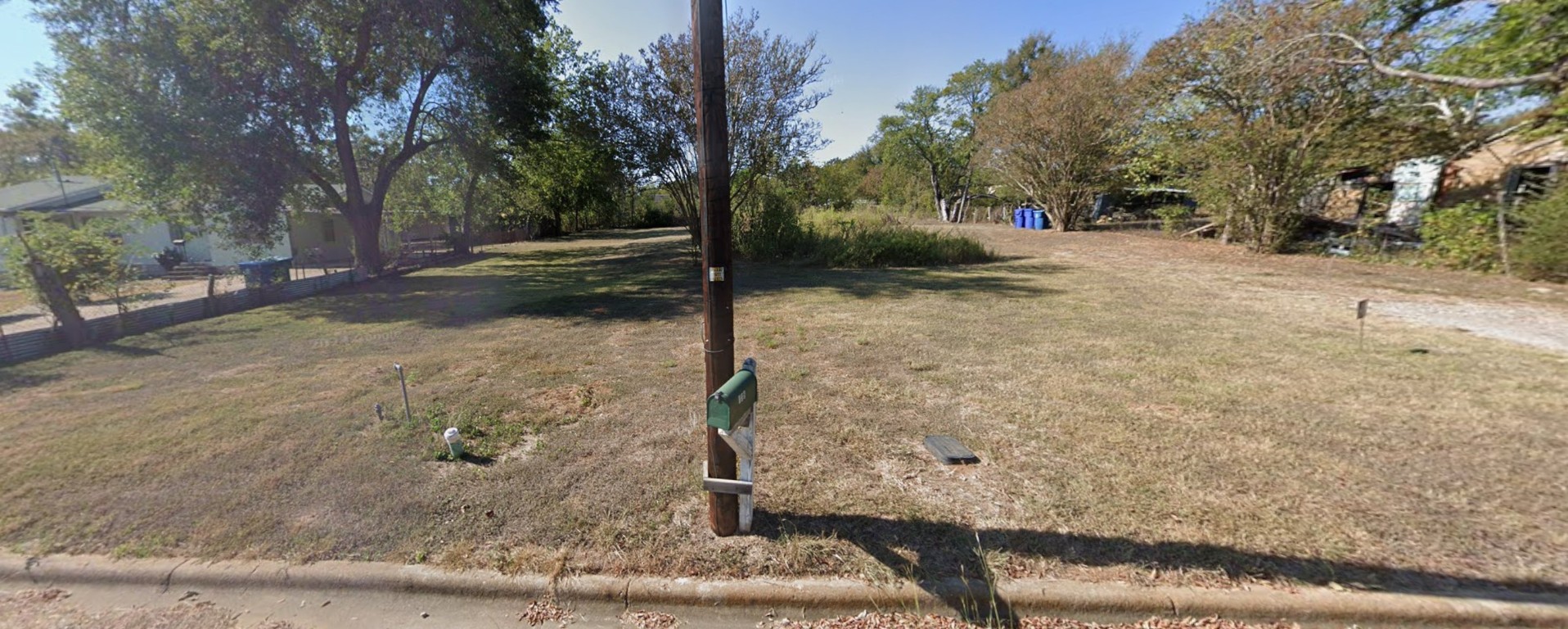 a view of a yard with trees