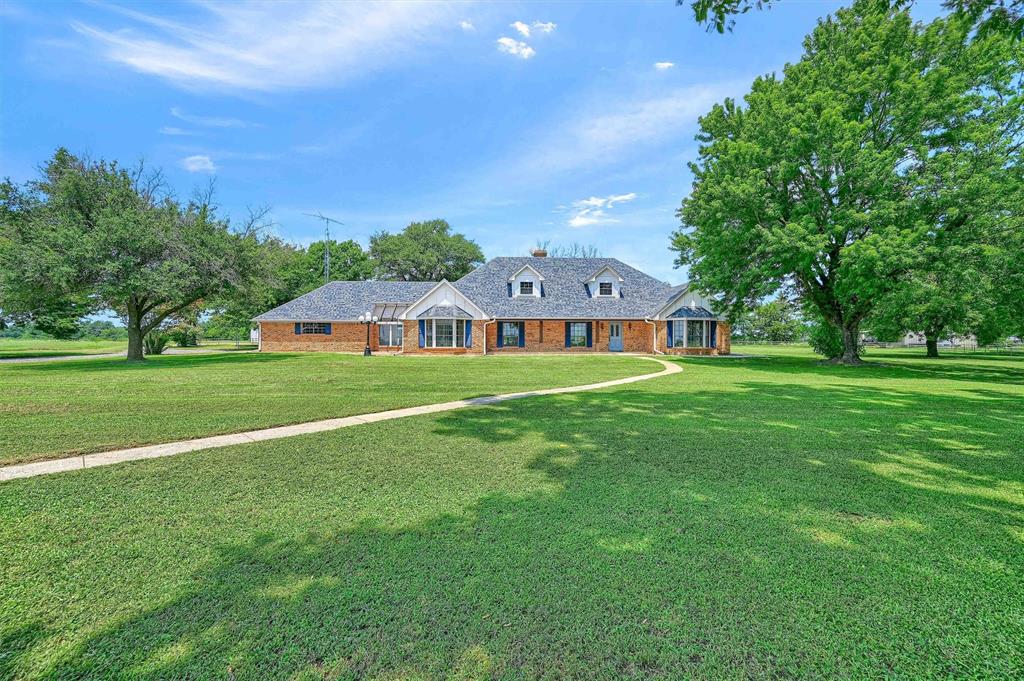 a aerial view of a house with a big yard