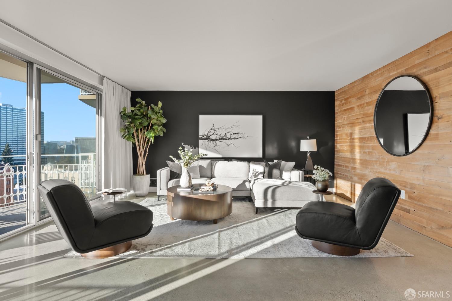 a living room with furniture potted plant and a large window