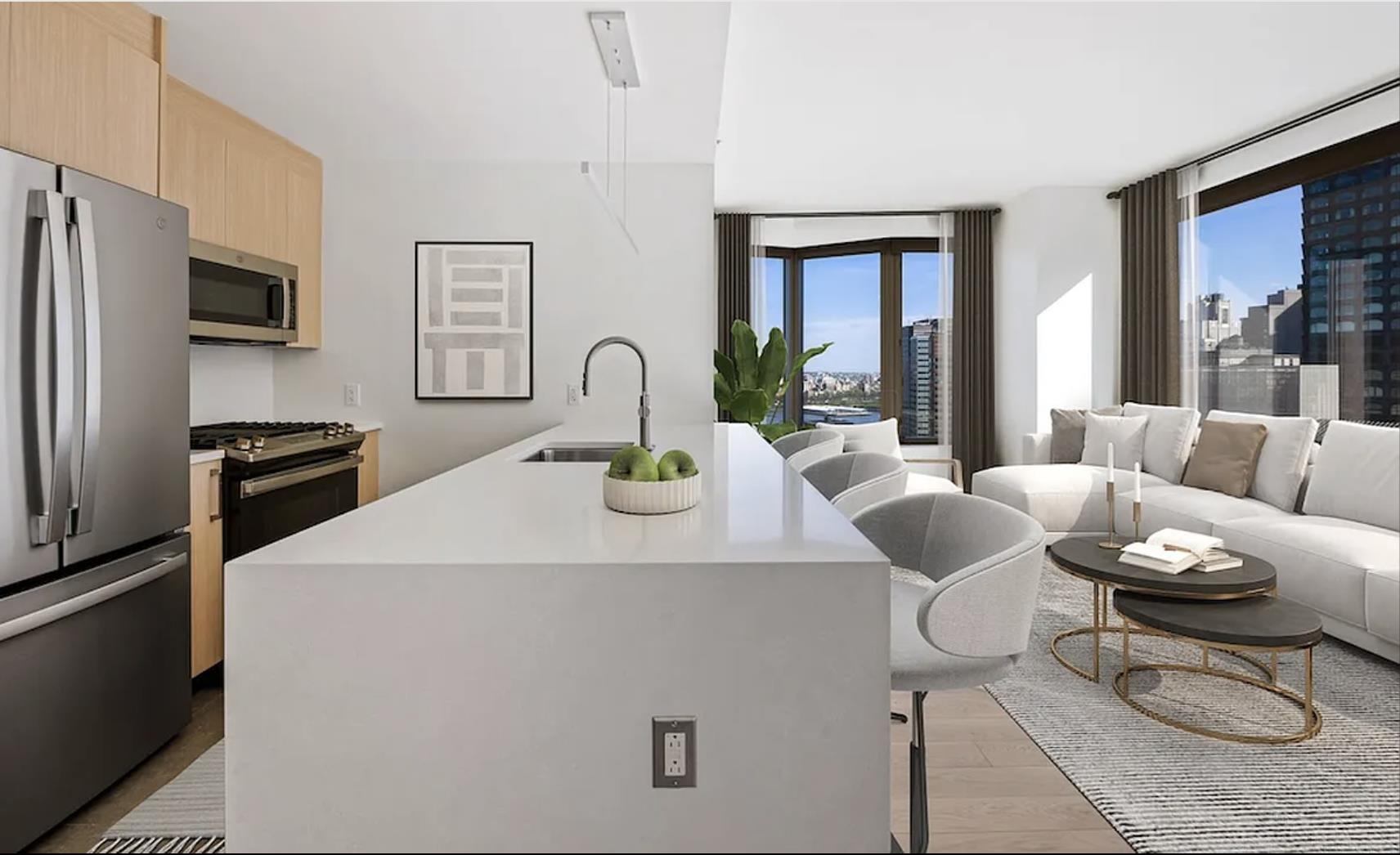 a living room with furniture a large window and kitchen view