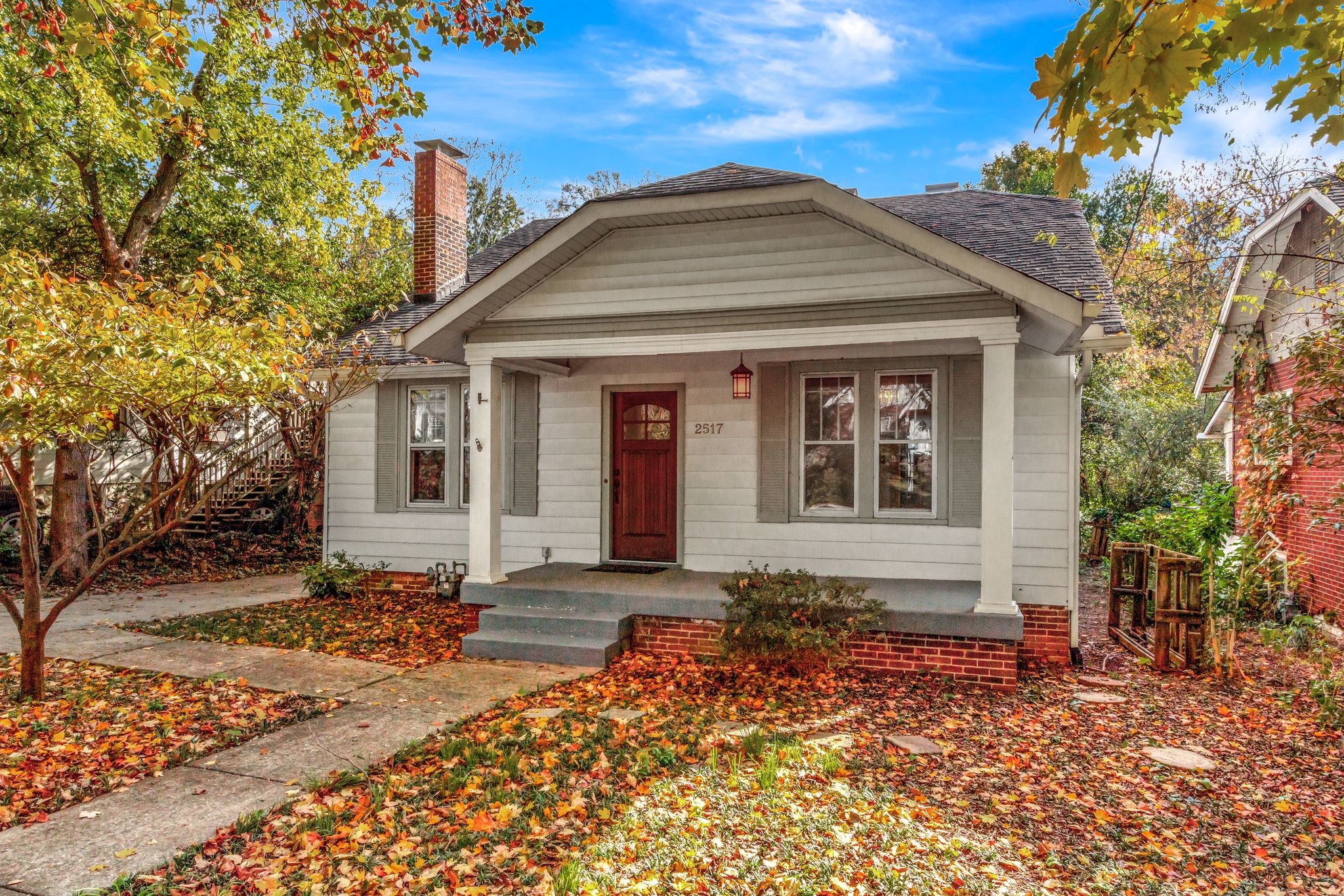 Charming 1930's bungalow with great curb appeal on a tree lined street with sidewalks.