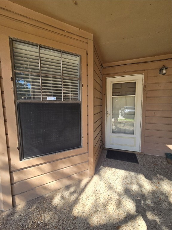 a view of a door and a window