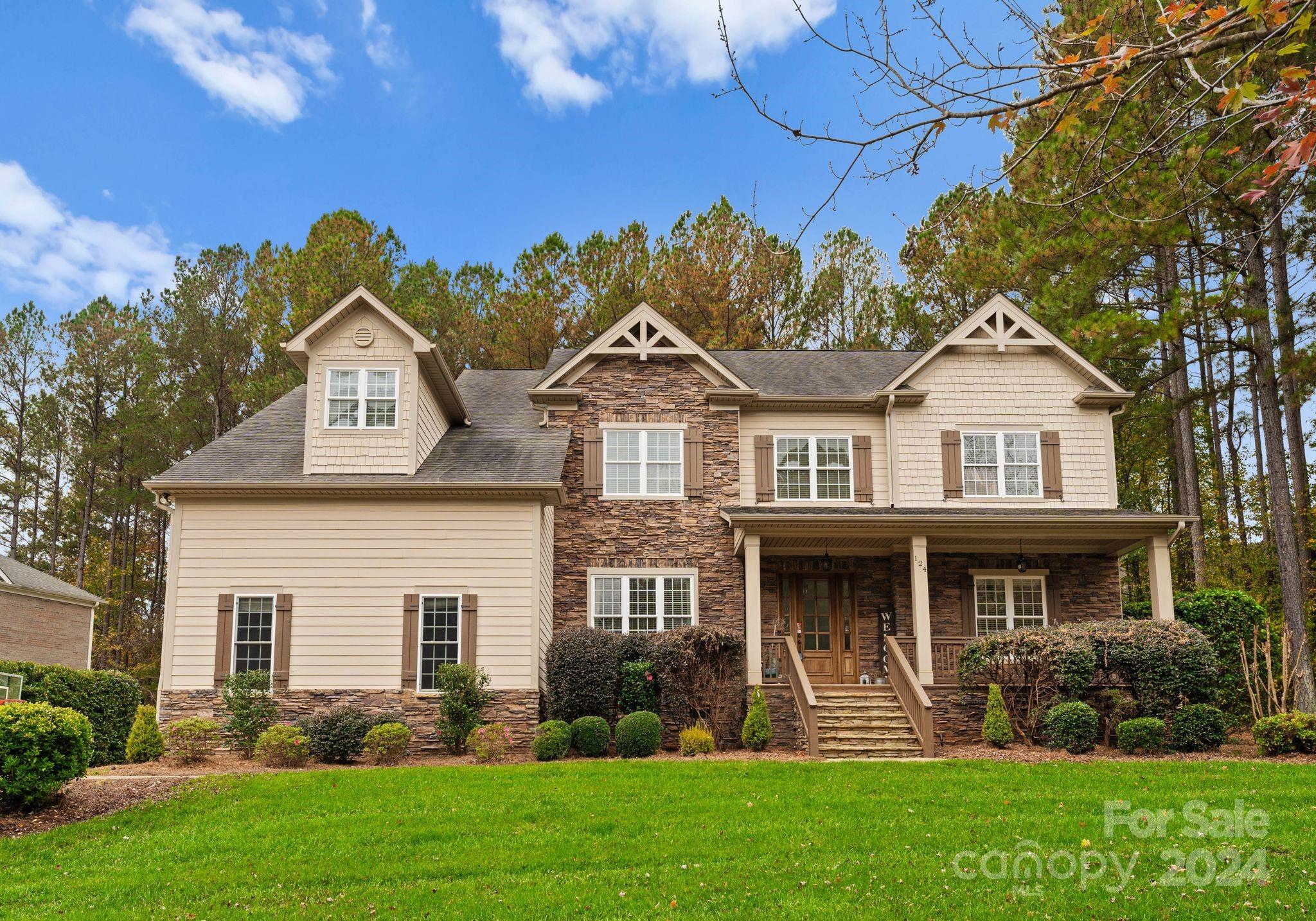 front view of a house with a yard