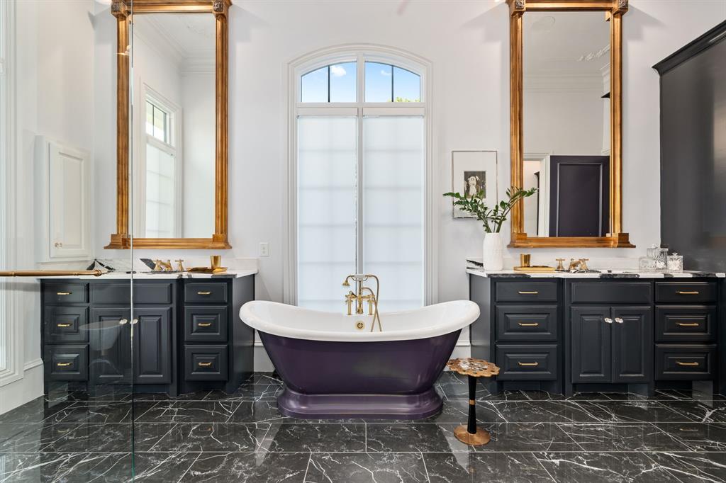 Bathroom with vanity and a bath