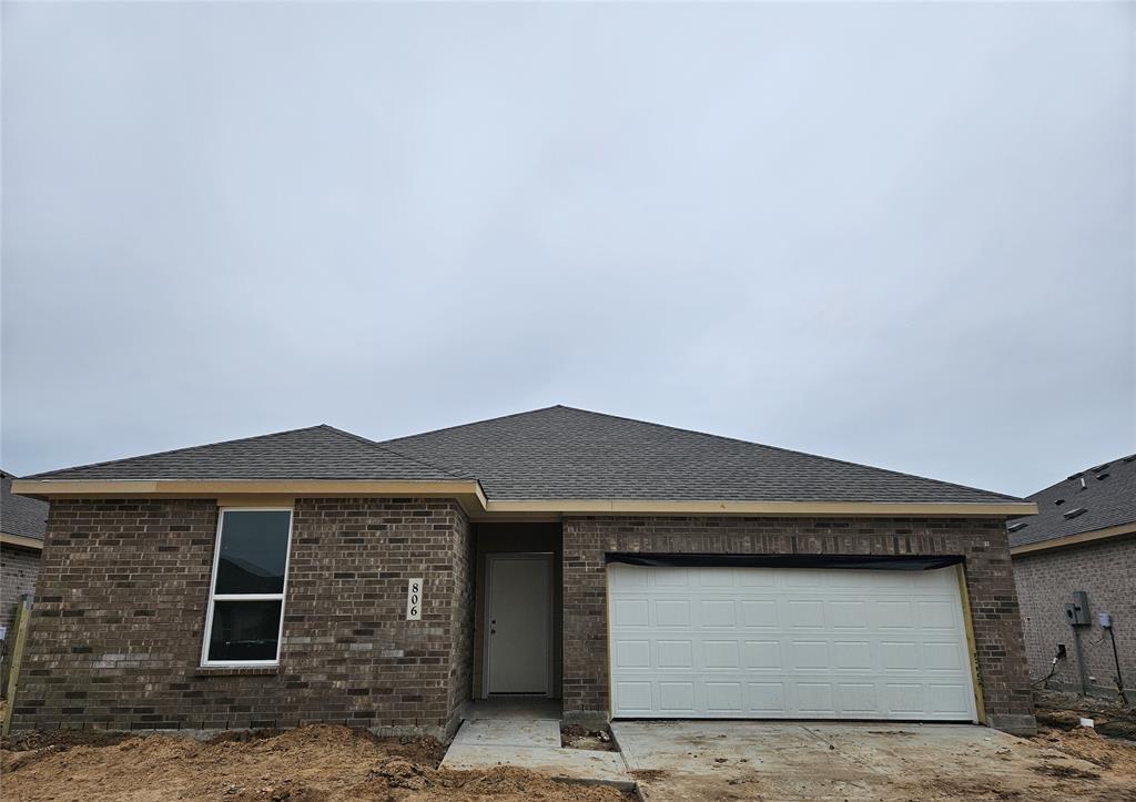 a front view of a house with a garage