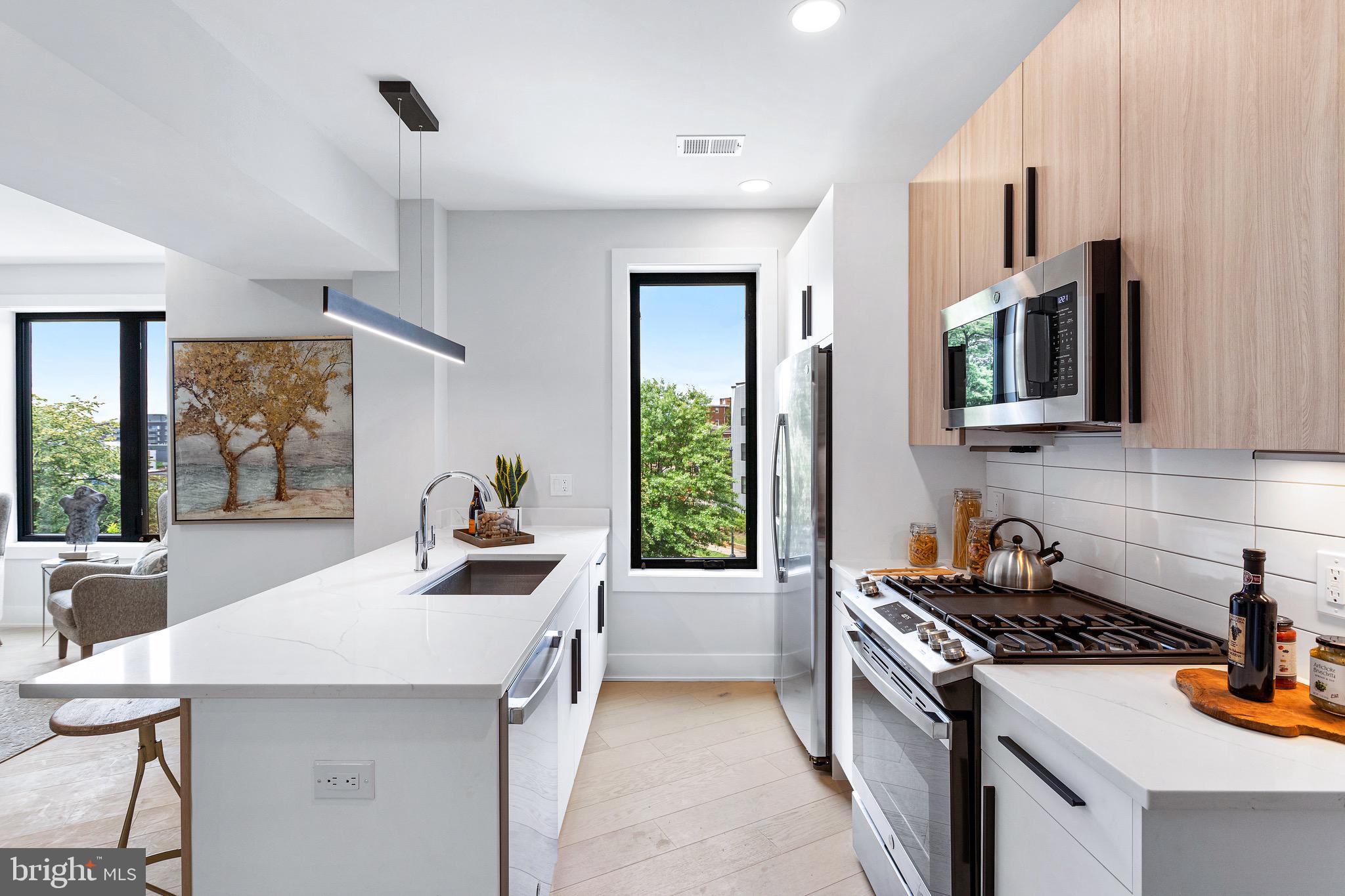 a kitchen that has a stove and a table