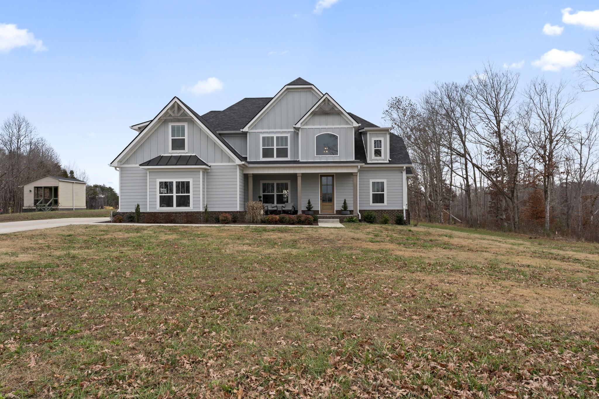 a front view of a house with a yard