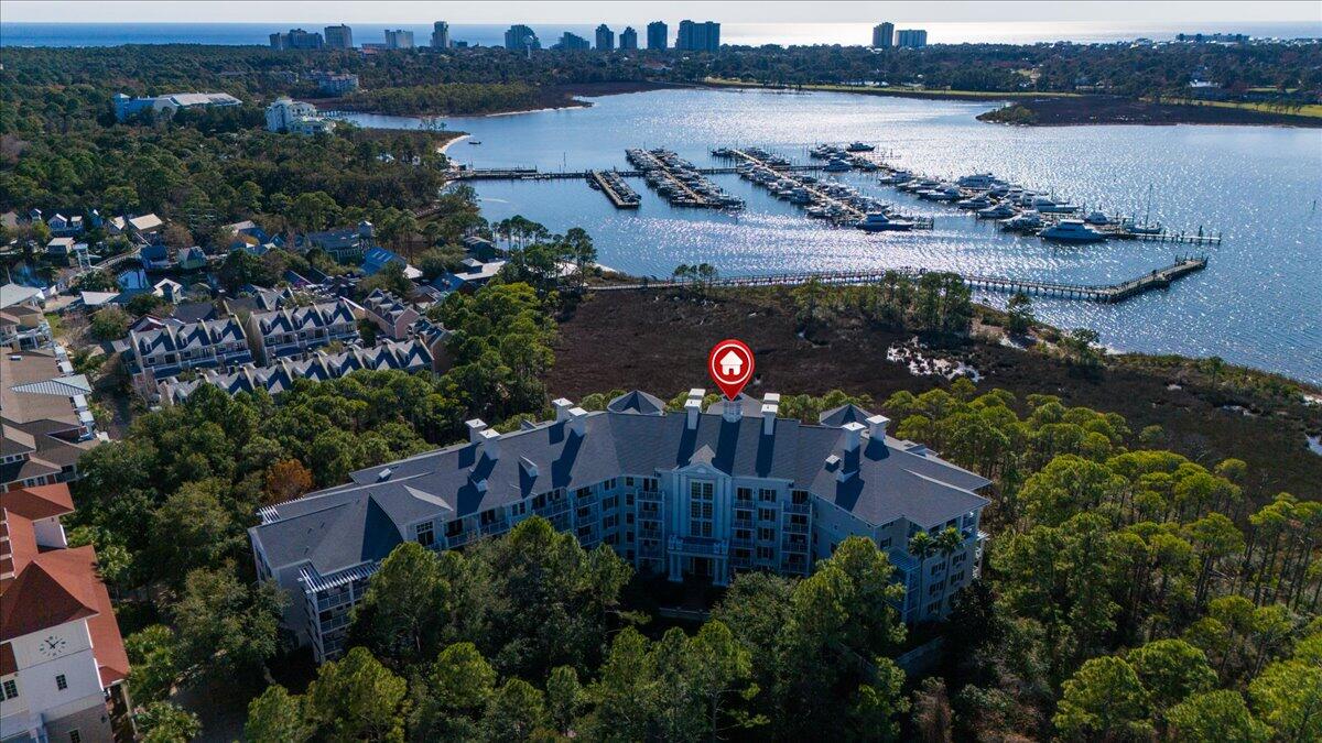 an aerial view of a house with a lake view