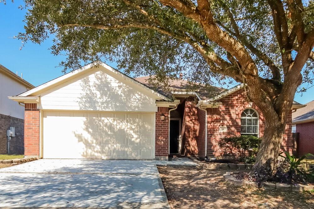 a view of a house with a tree