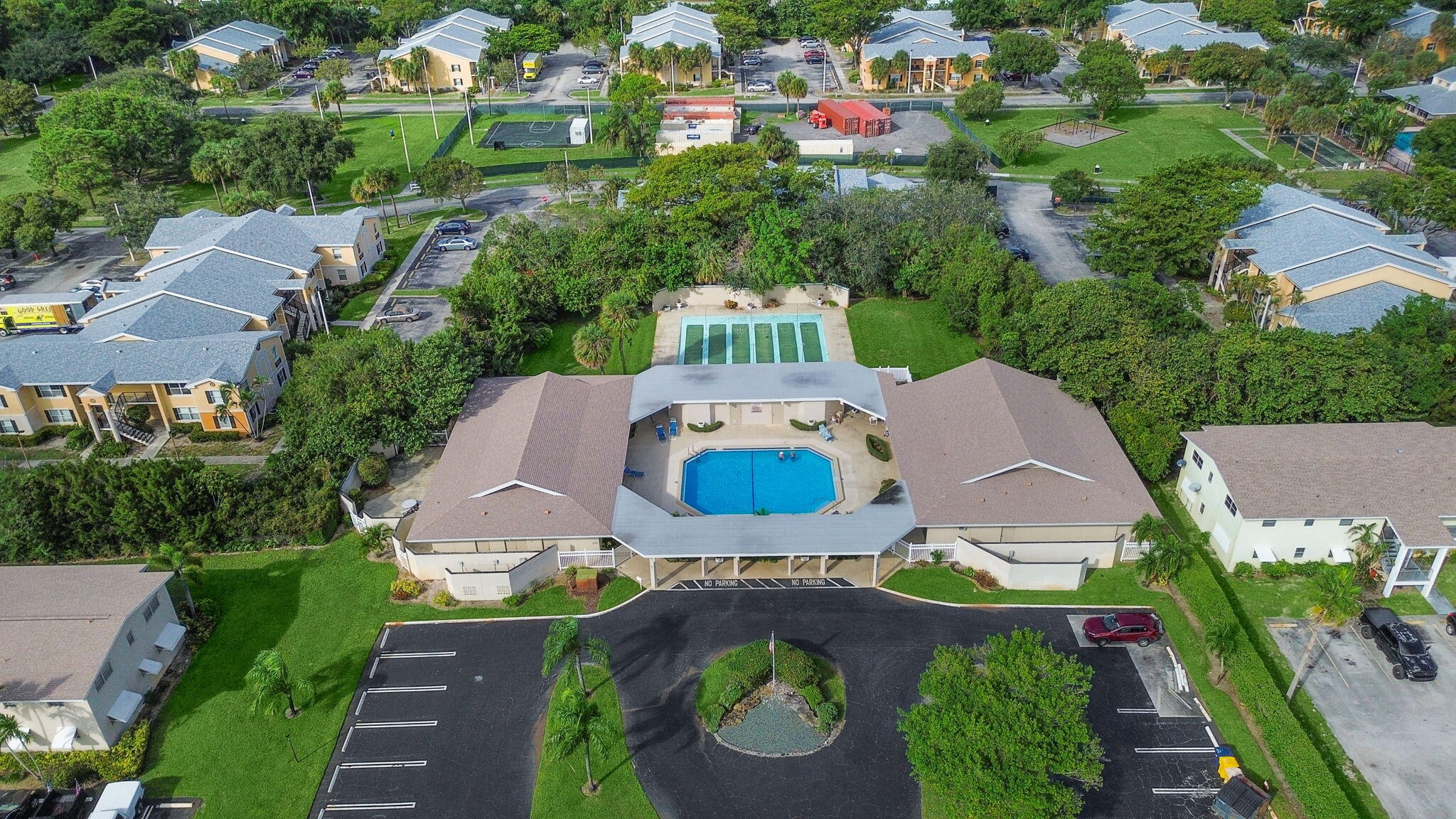 an aerial view of a house with yard swimming pool and outdoor seating