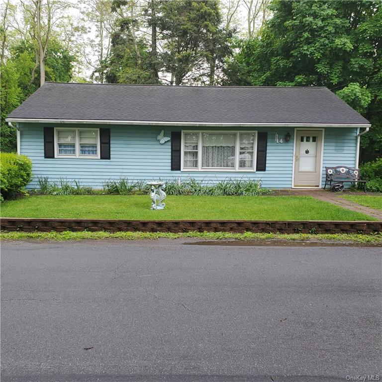 a front view of a house with a garden and porch