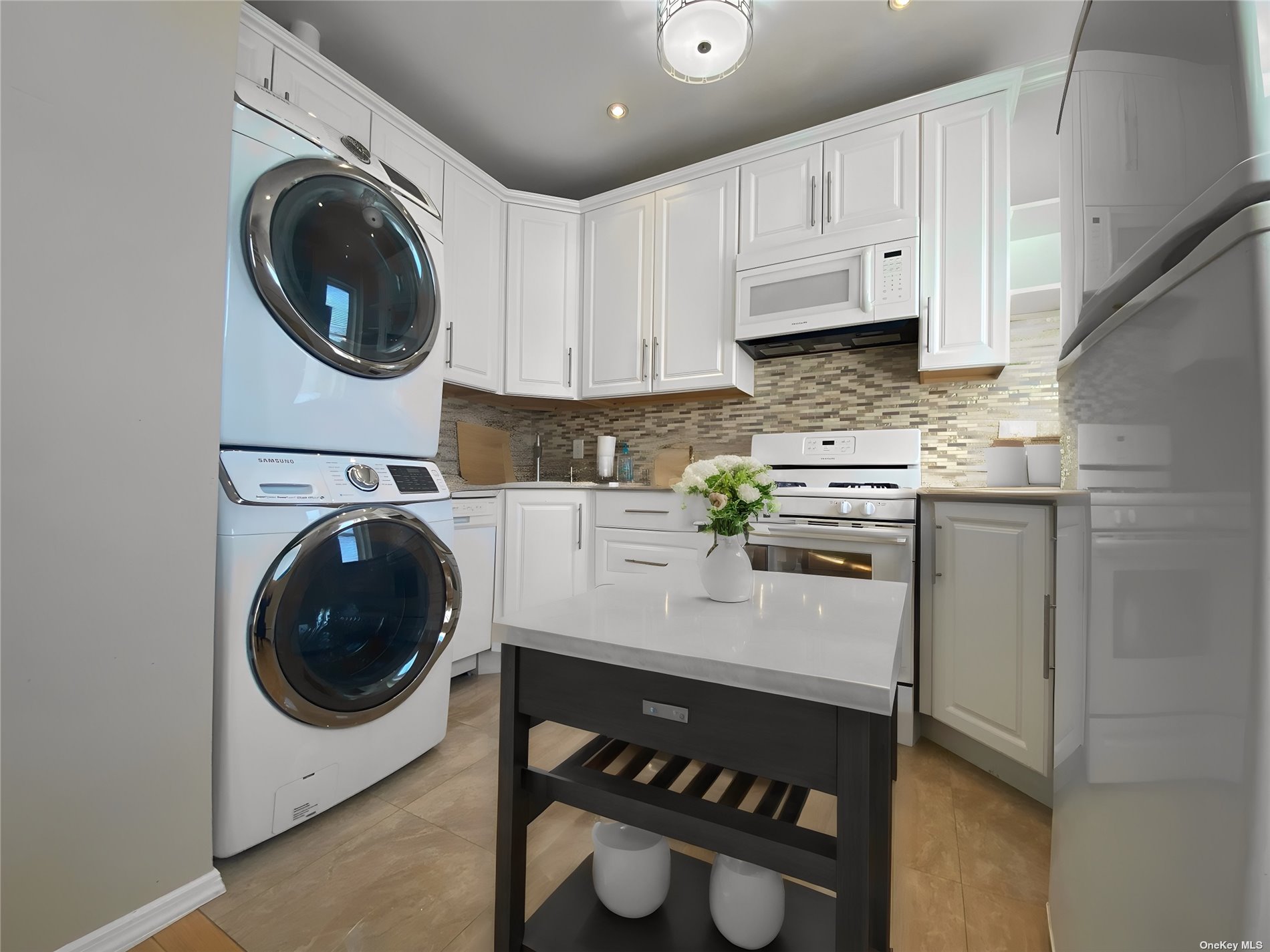 a kitchen with a sink a stove and cabinets