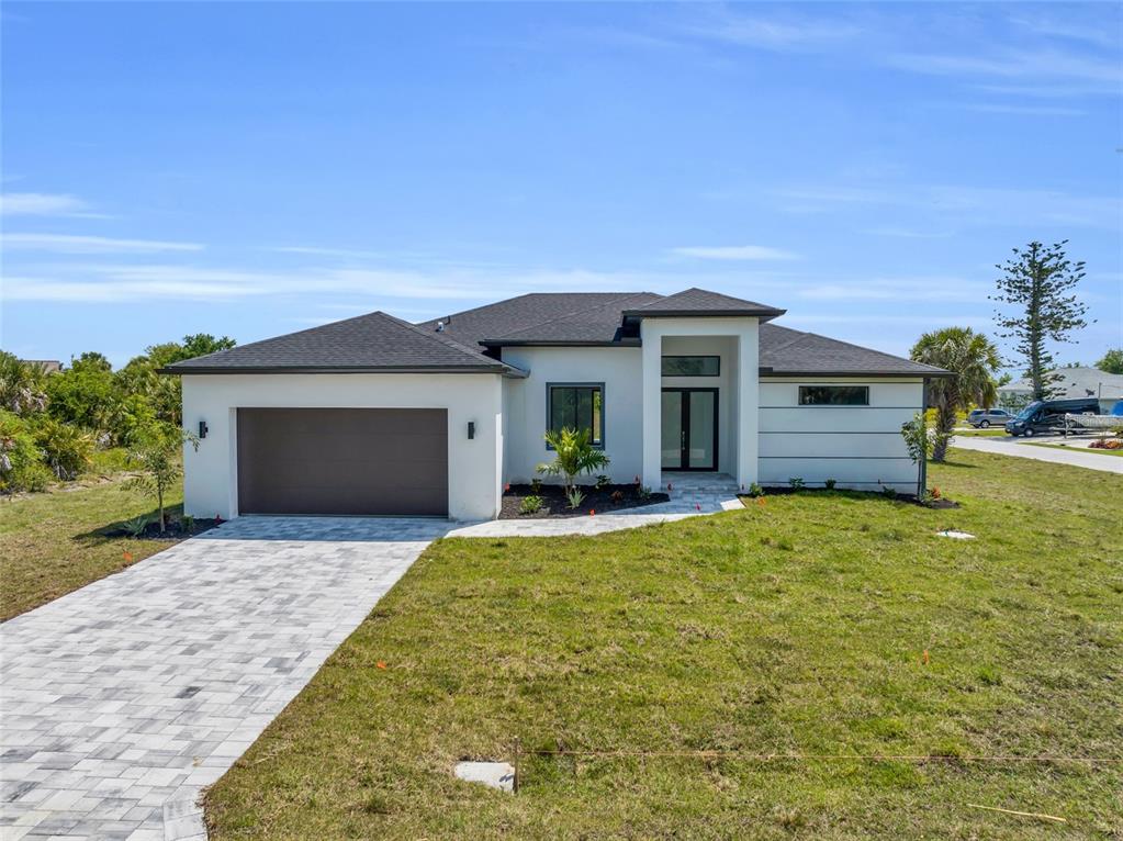 a front view of a house with a yard