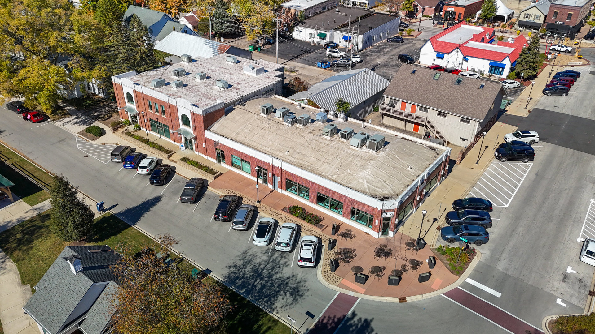 an aerial view of a city with parking