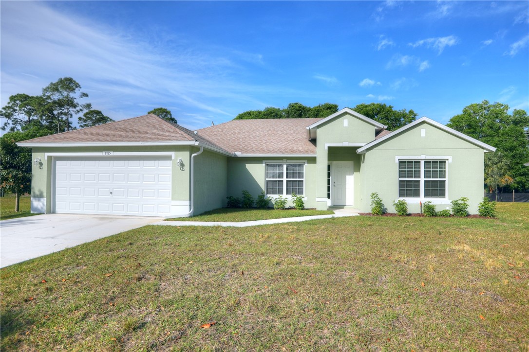 front view of a house with a yard