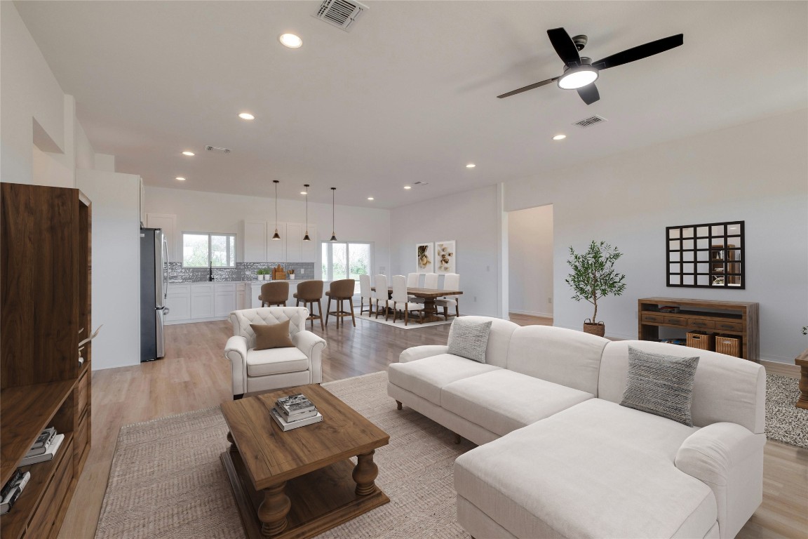 a living room with furniture fireplace and a flat screen tv