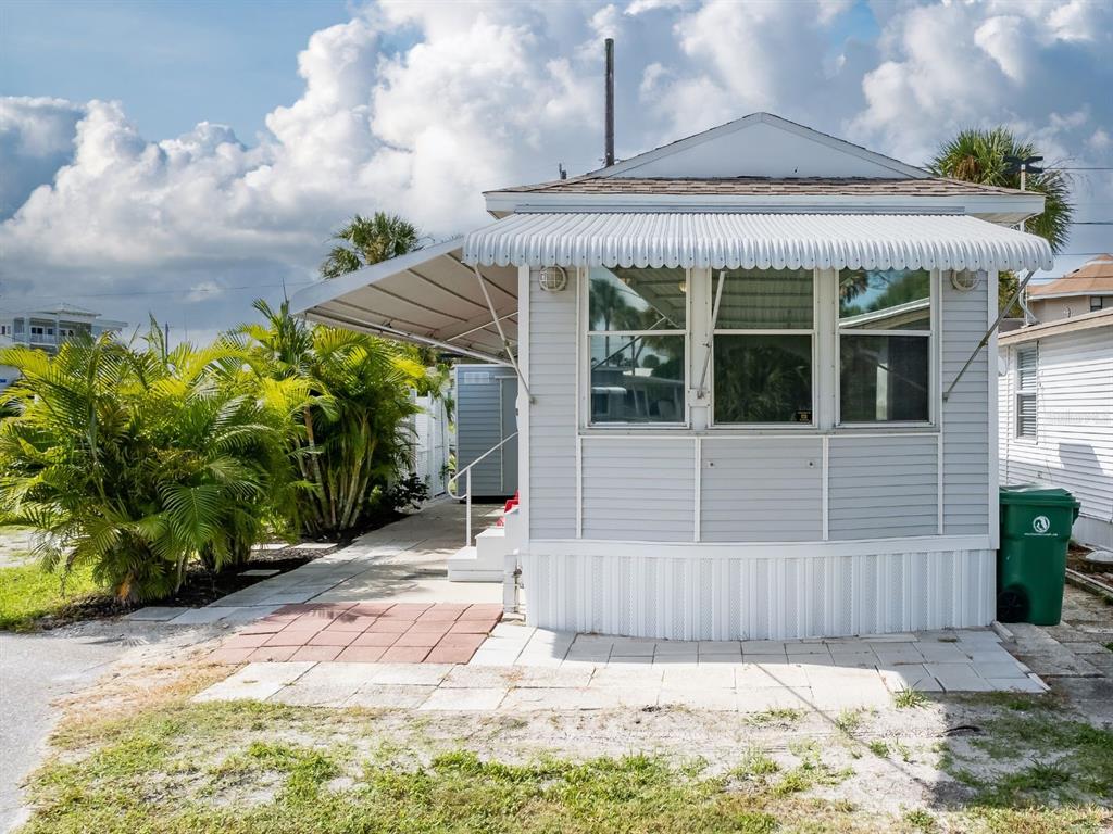 a view of a house with a wooden fence