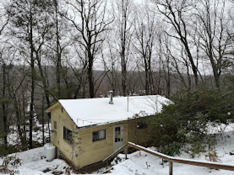 a view of a house with a snow on the yard