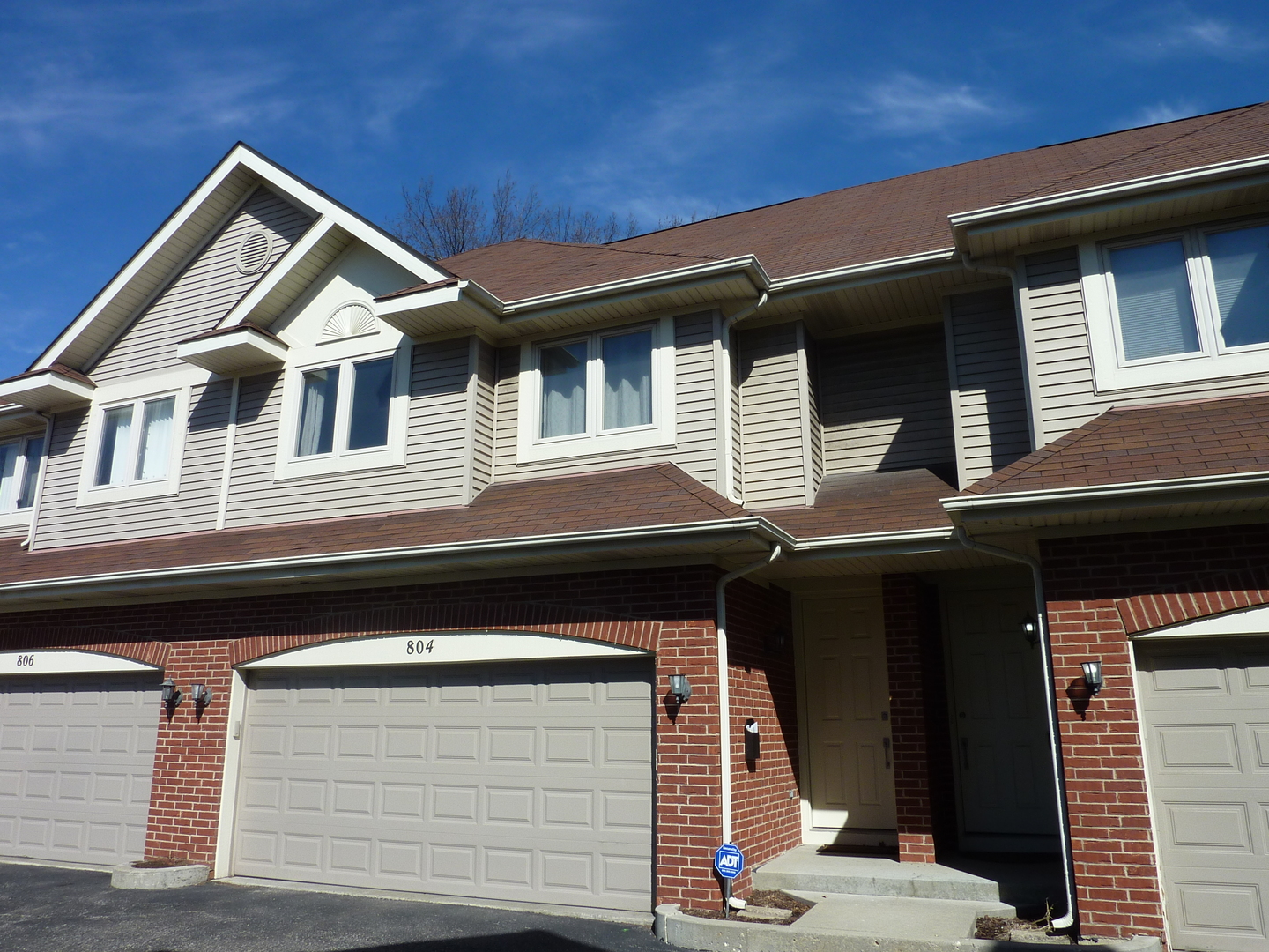 a front view of a house with a garage