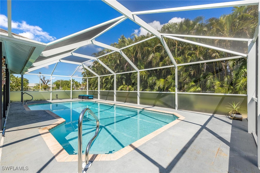 a view of a backyard with a swimming pool