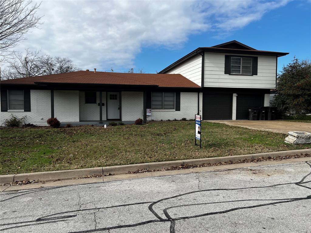 a front view of a house with garage