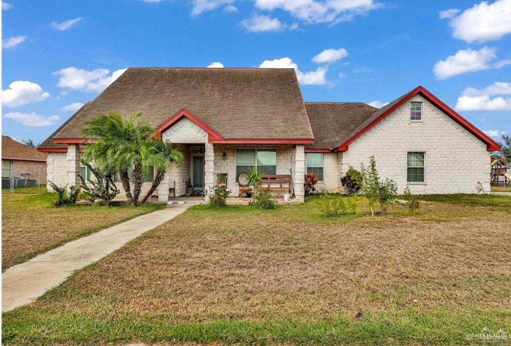 a view of a house with a yard