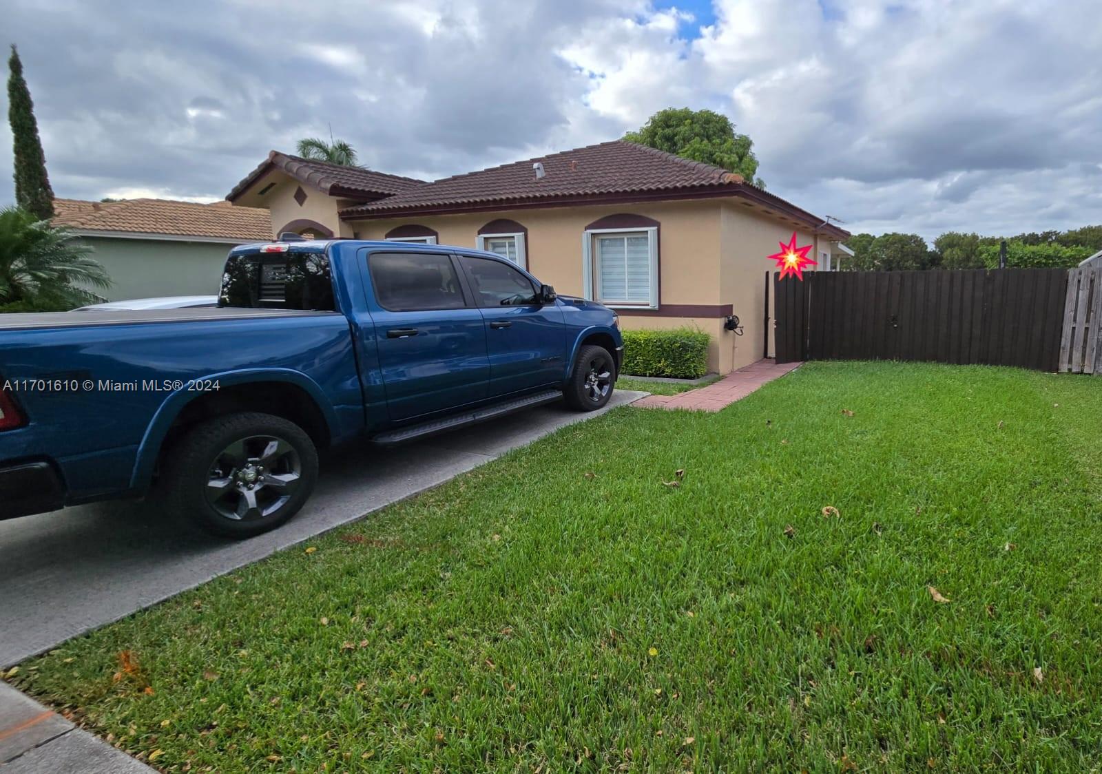 a view of a house with a back yard