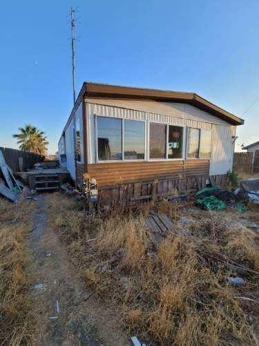 a house view with a backyard space