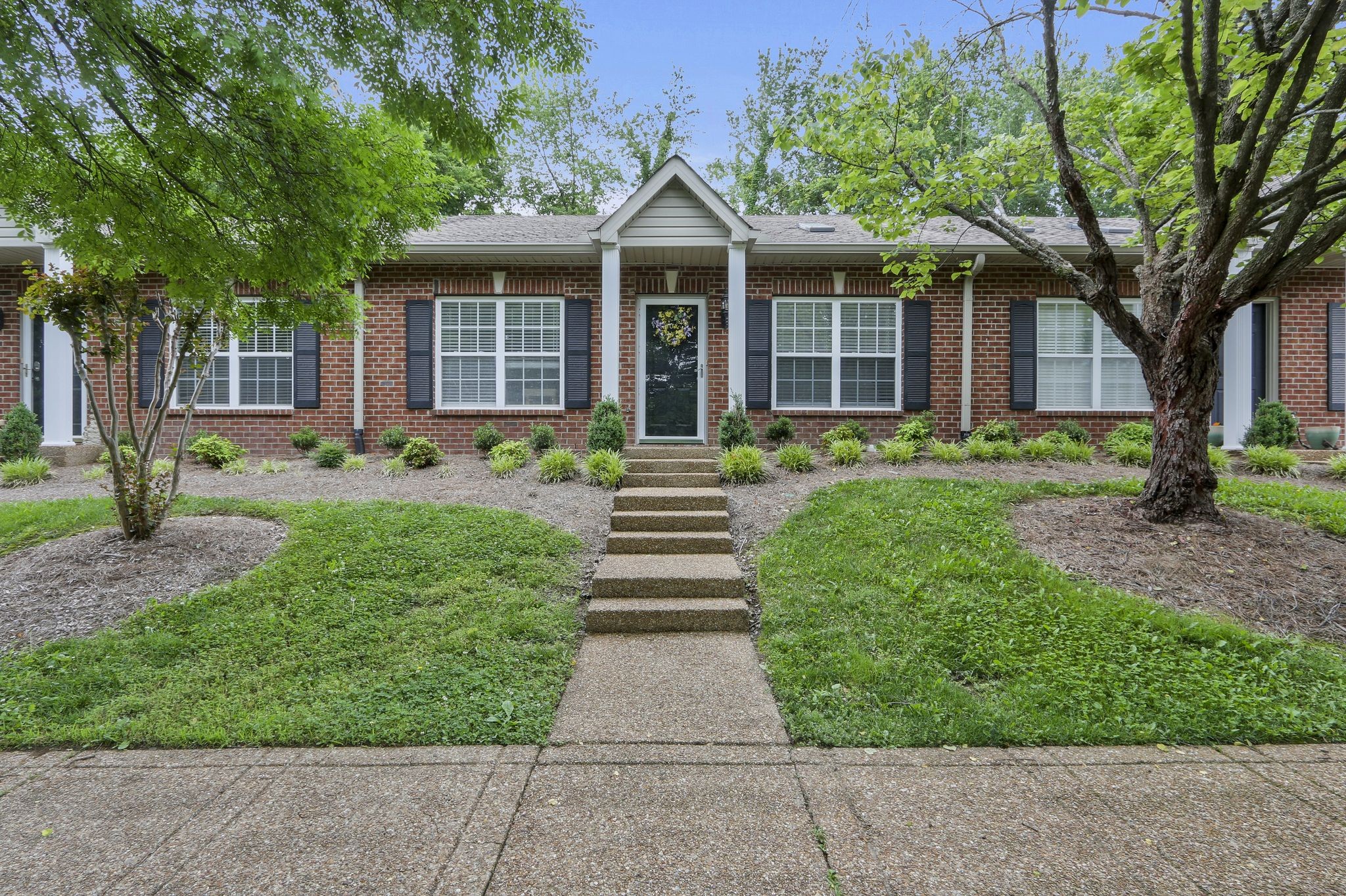 front view of a house with a yard