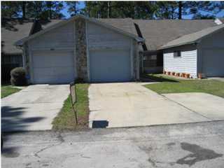 a side view of a house with a yard