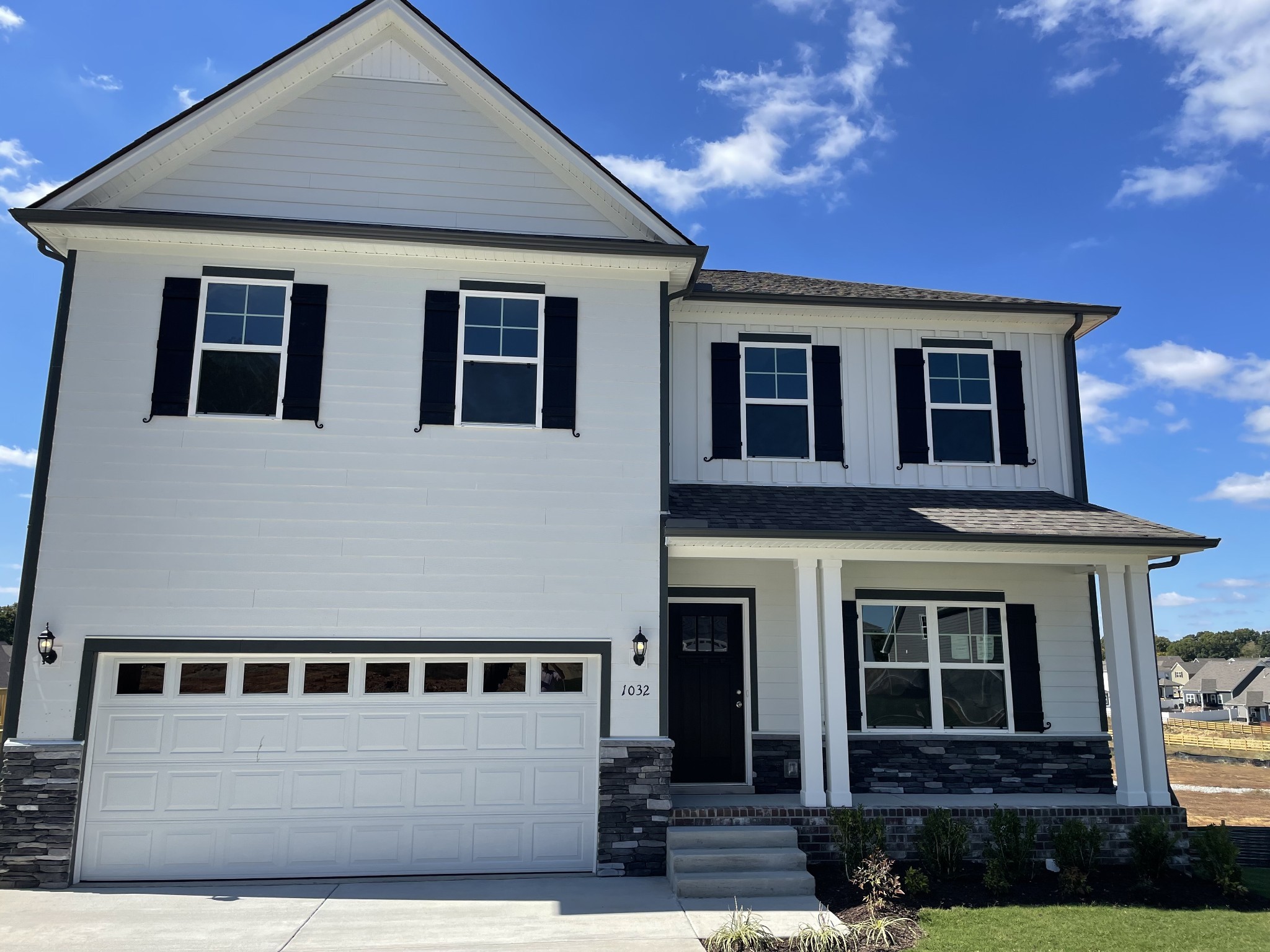 a front view of a house with yard