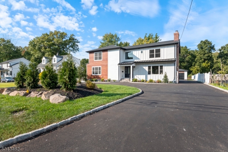 a view of multiple houses with a yard