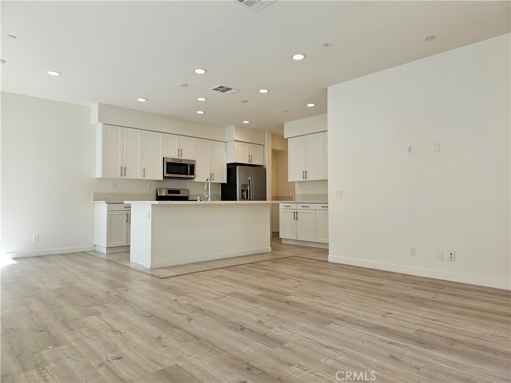 a view of kitchen with wooden floor