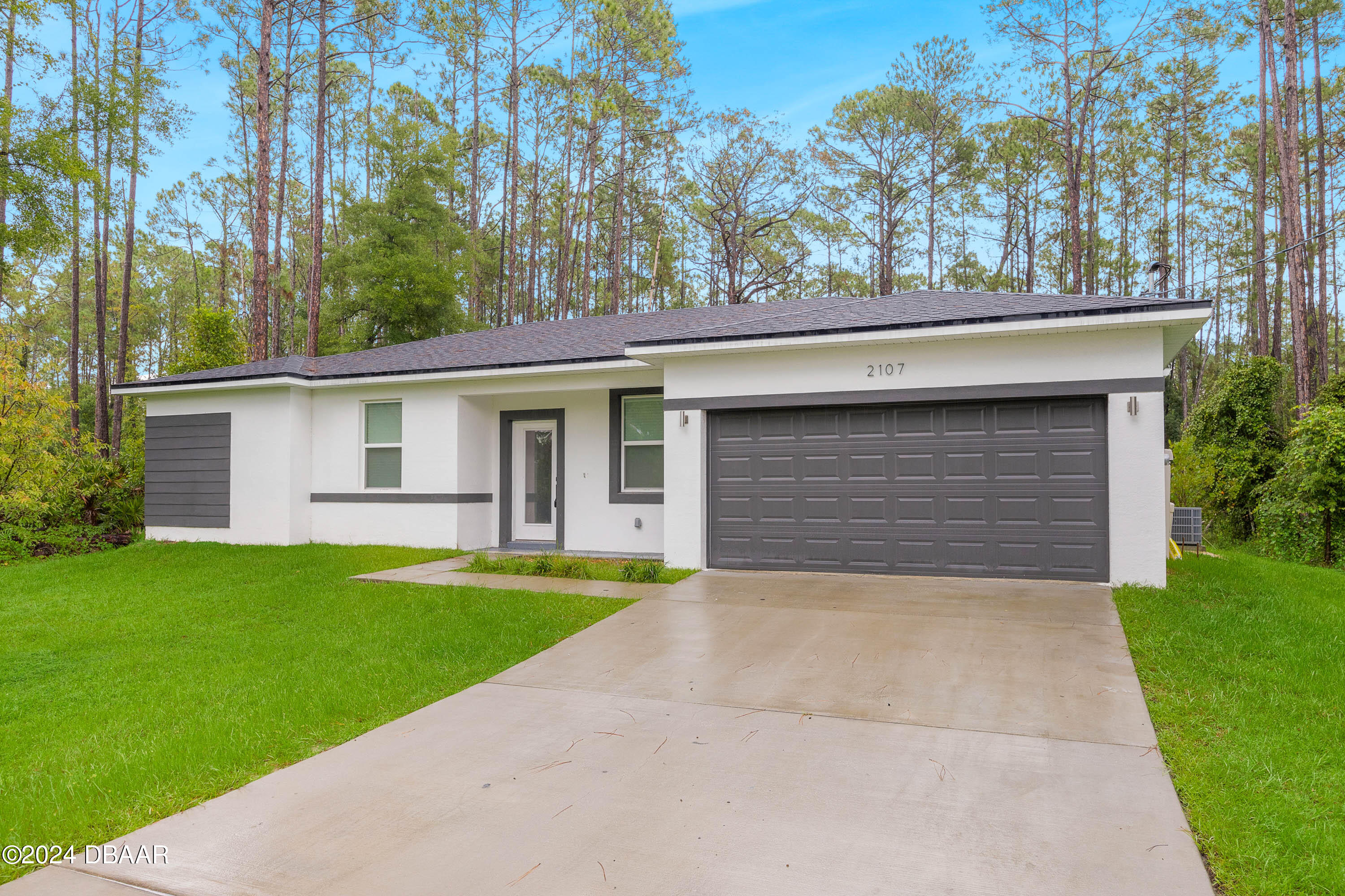 front view of a house with a yard