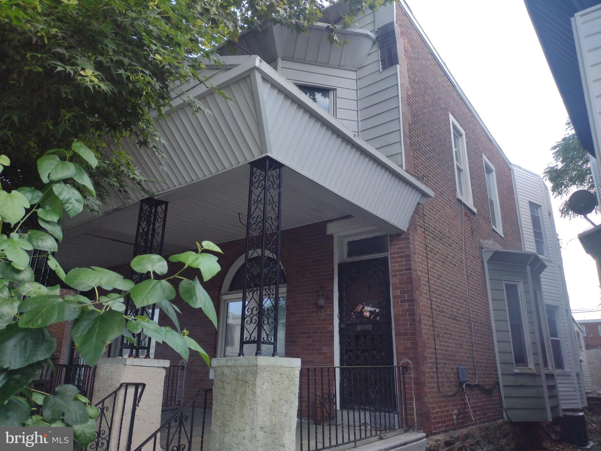 a house view with a potted plant