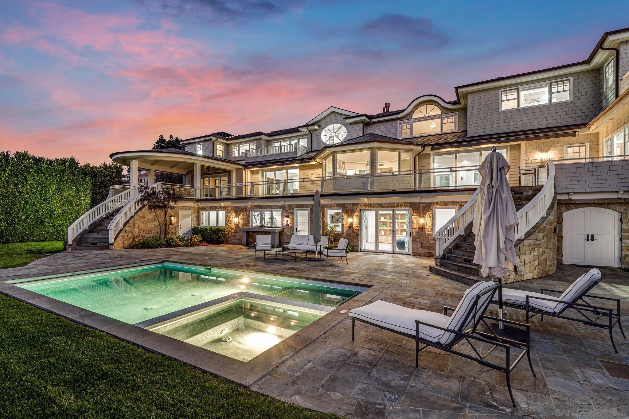 a view of a house with a chairs in a patio