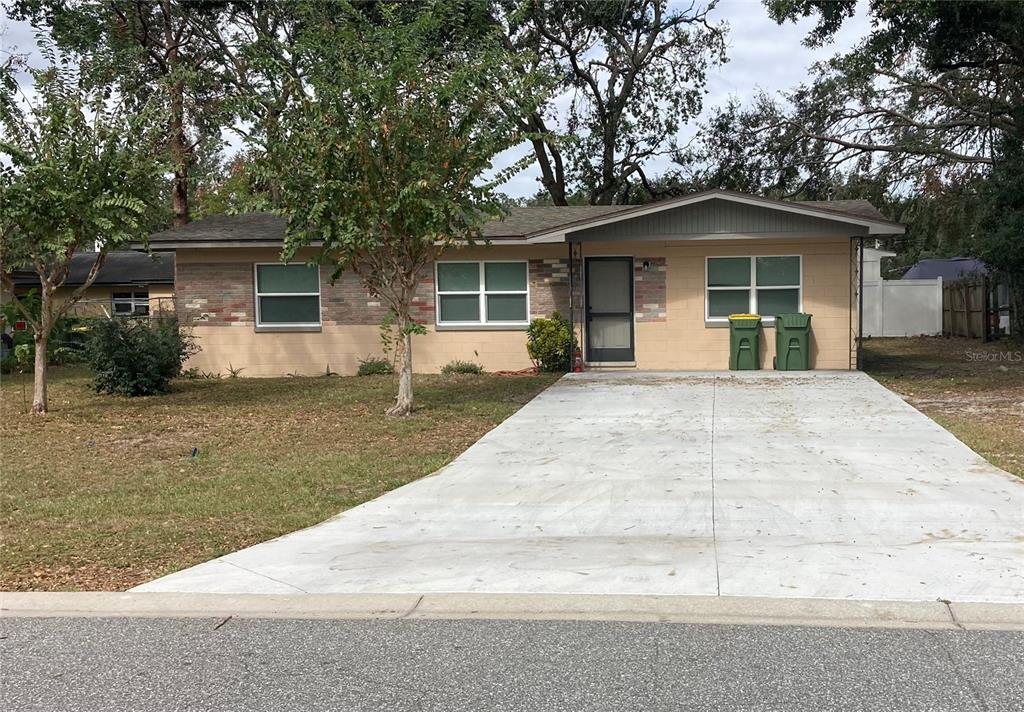 front view of a house with a yard