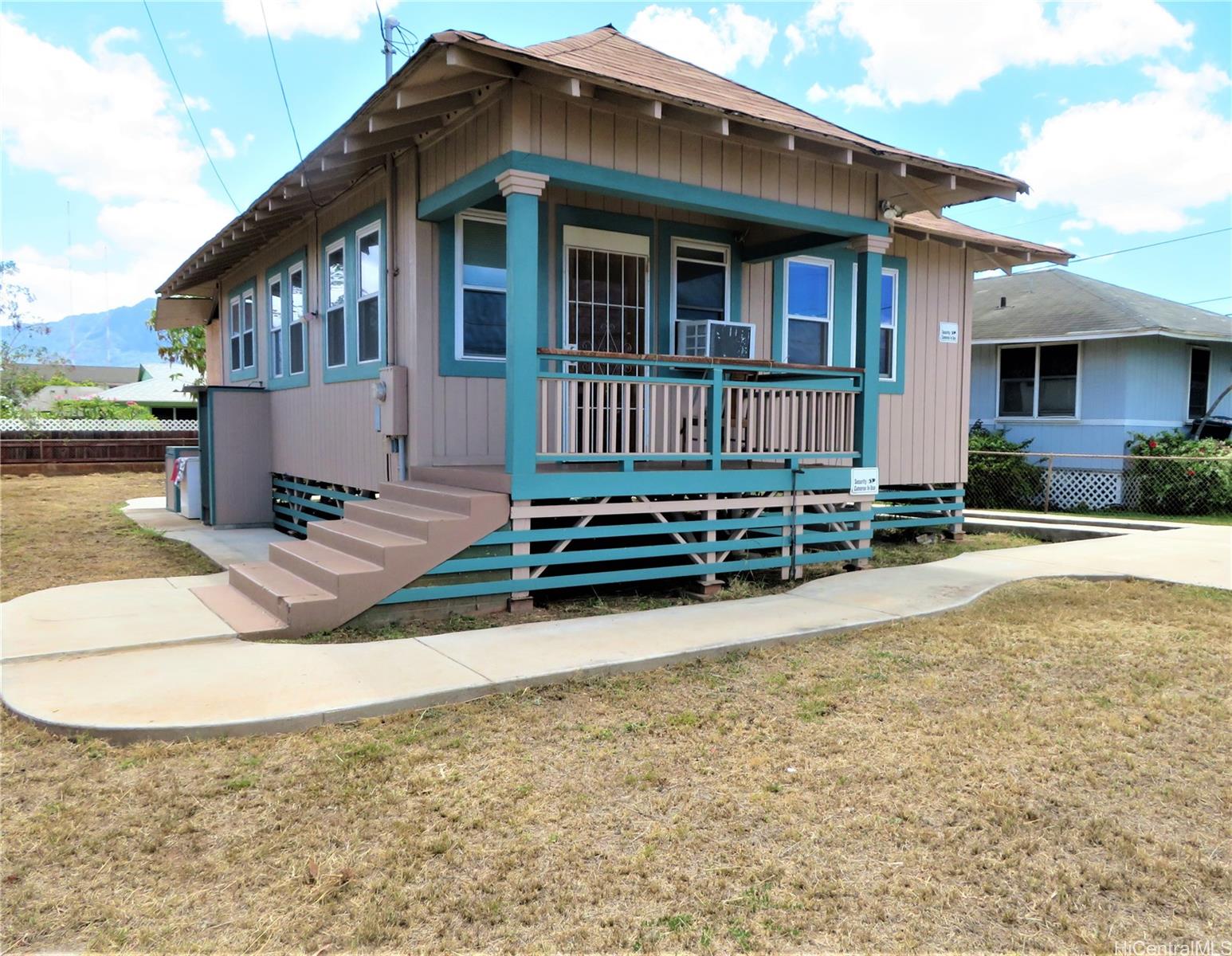 a view of a house with wooden floor and a yard