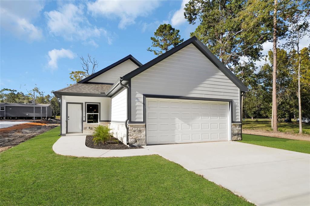 a front view of house with yard and outdoor seating