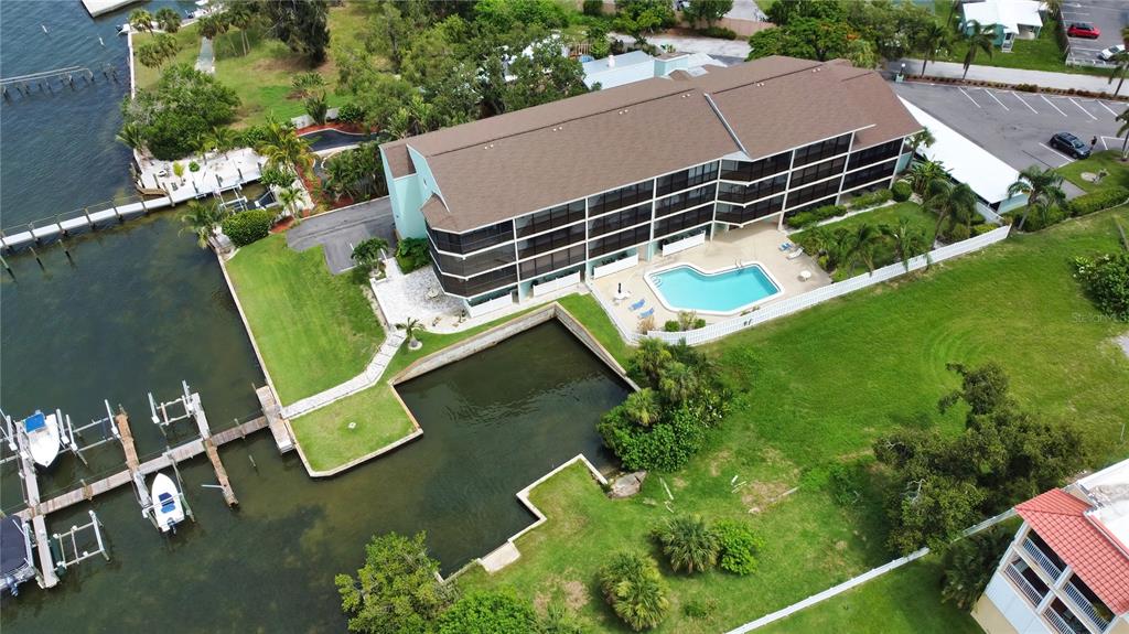 an aerial view of a house with a garden and a yard