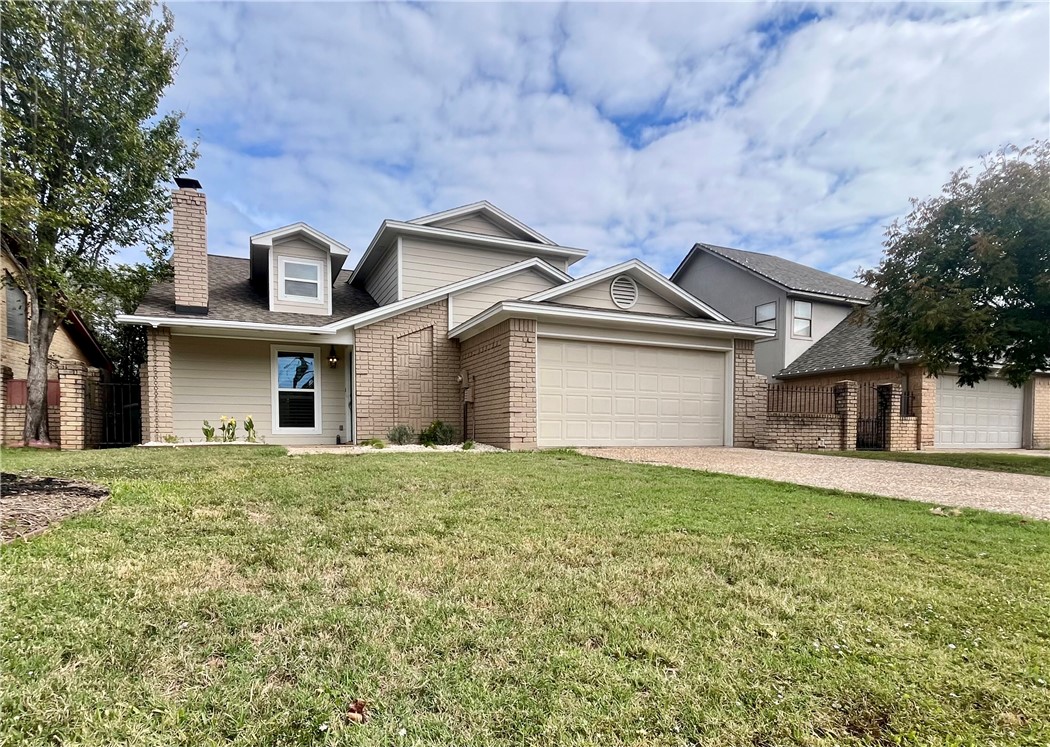 front view of a house with a yard