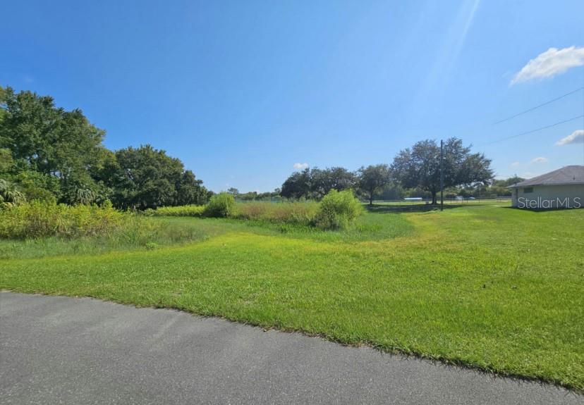 a view of a lake with a big yard