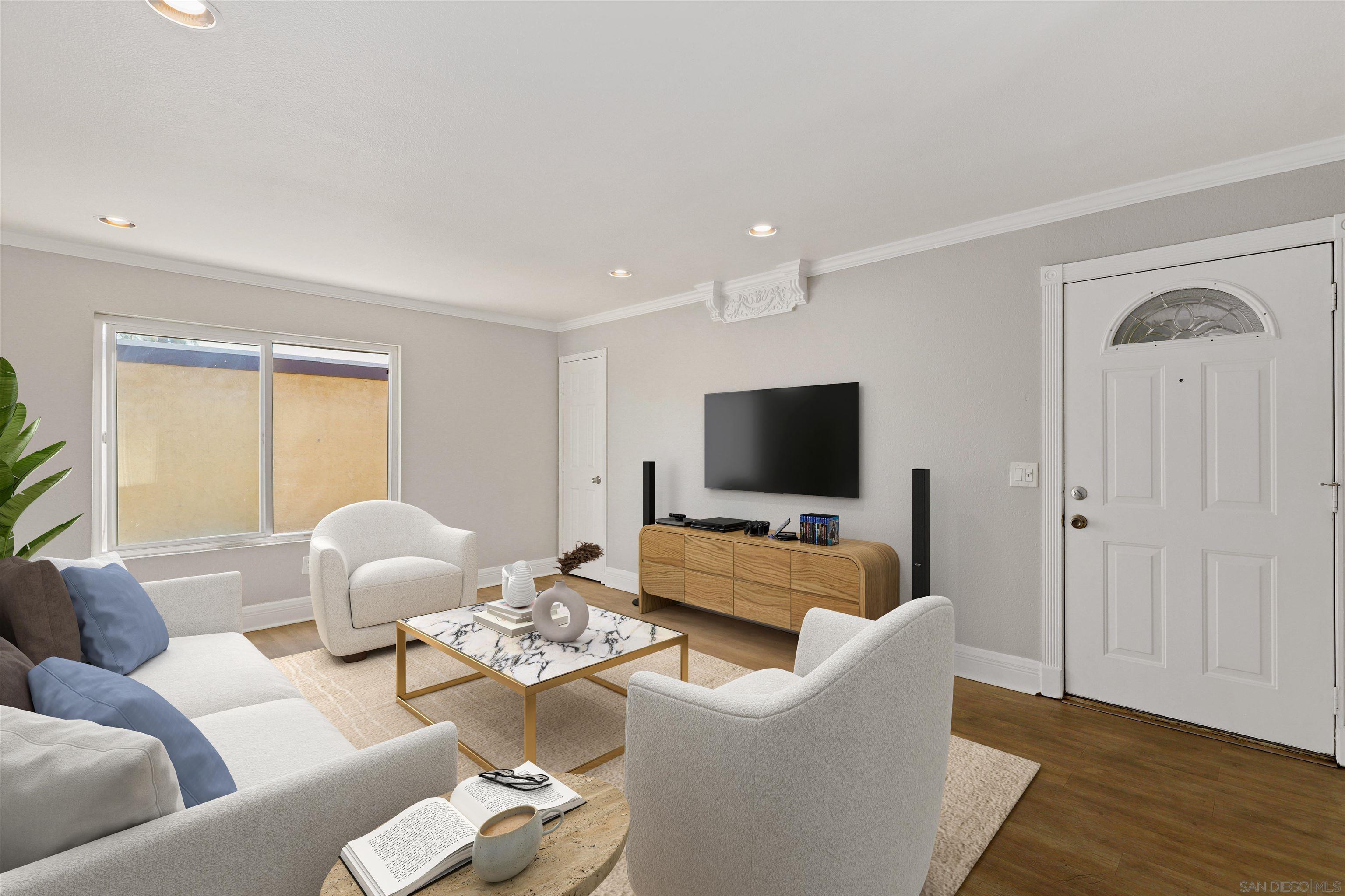 a living room with furniture and a flat screen tv