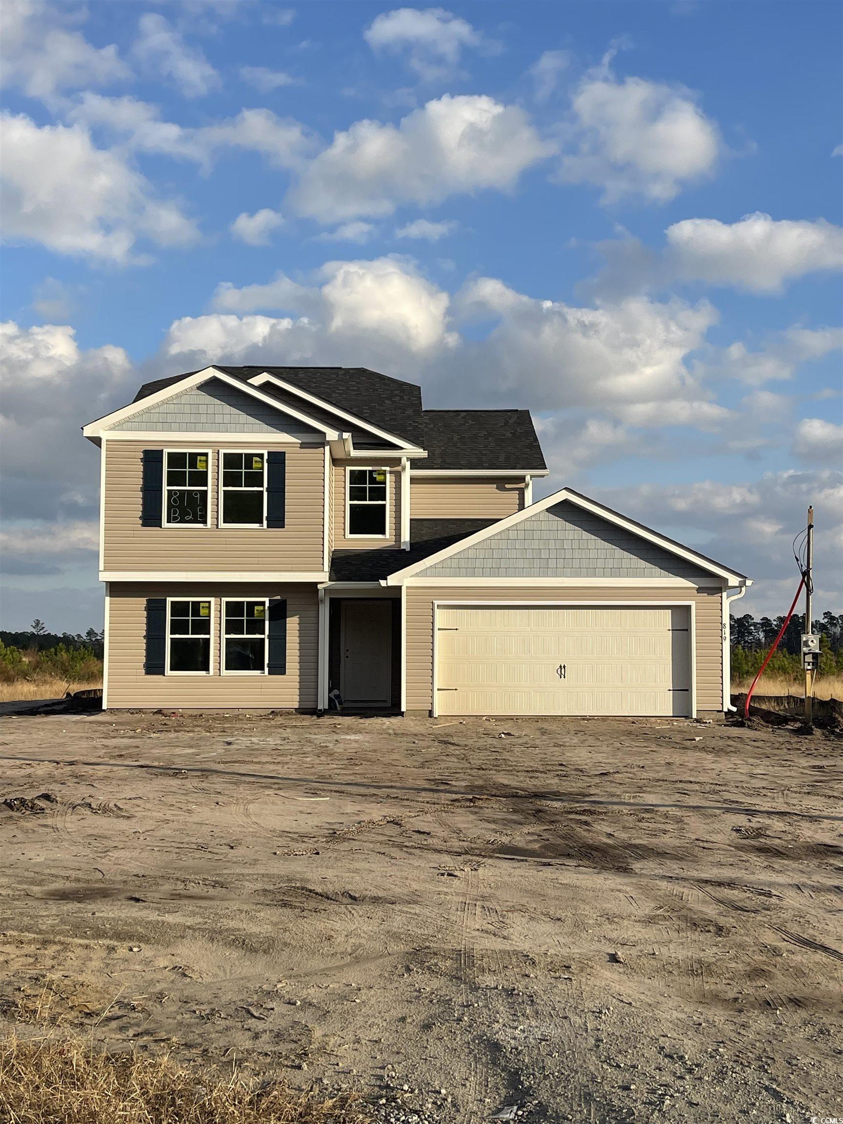 View of front of property with a garage