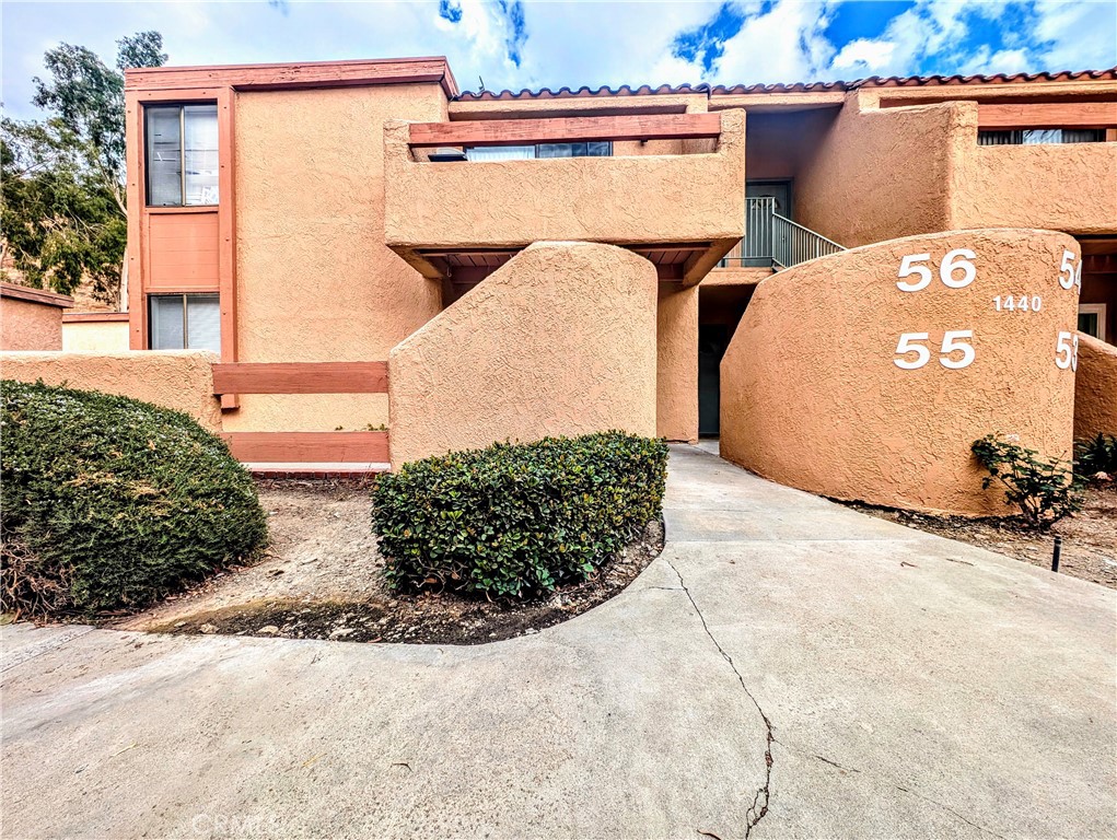 Multiple walk ways lead to the front door of unit 55