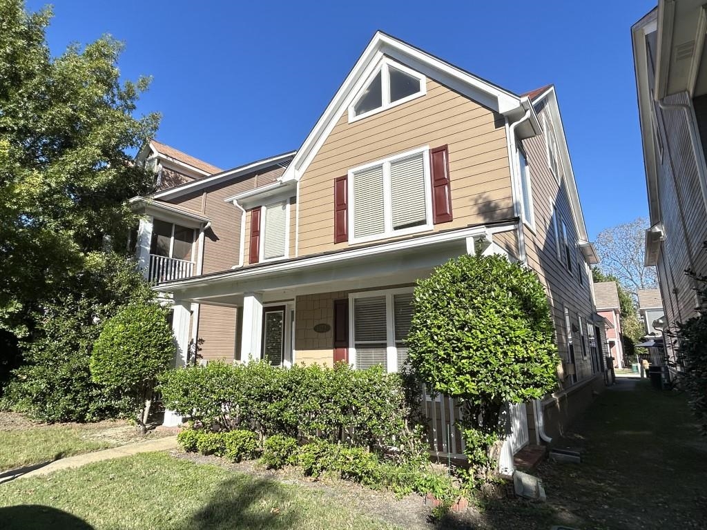 View of front of property with a front yard