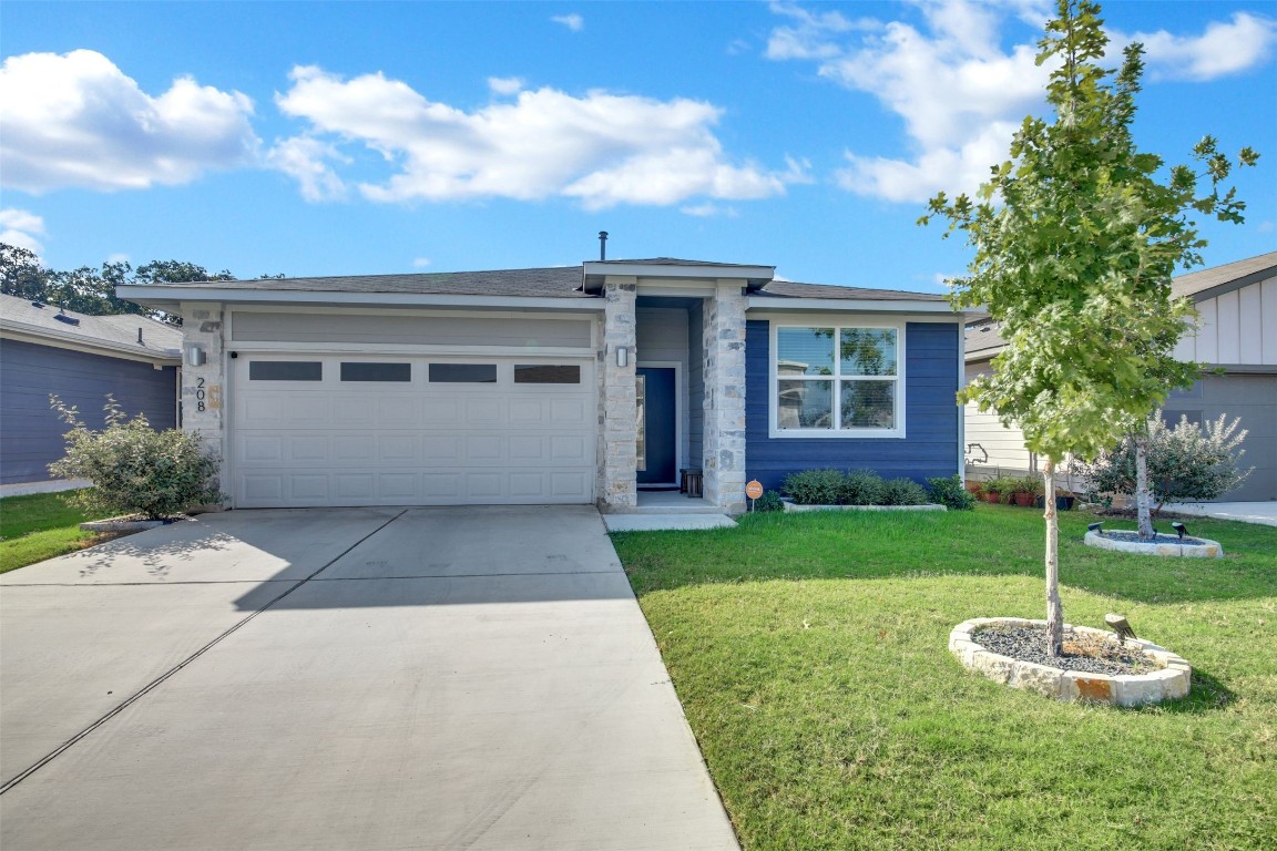 a front view of a house with a yard