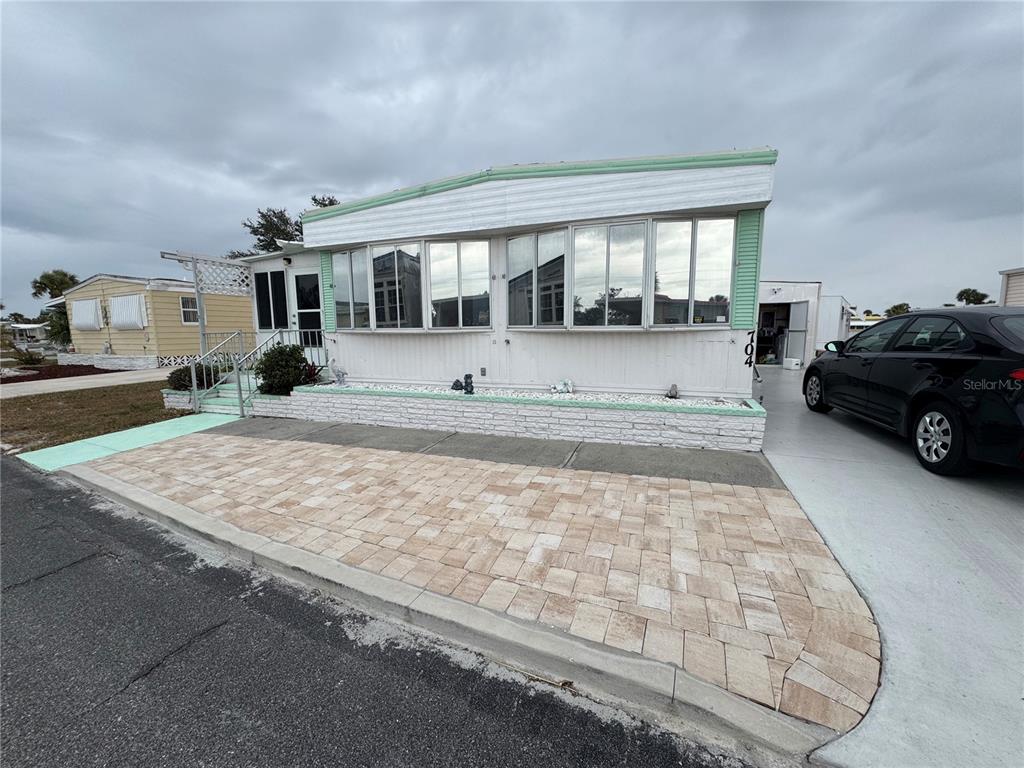 a car parked in front of a house