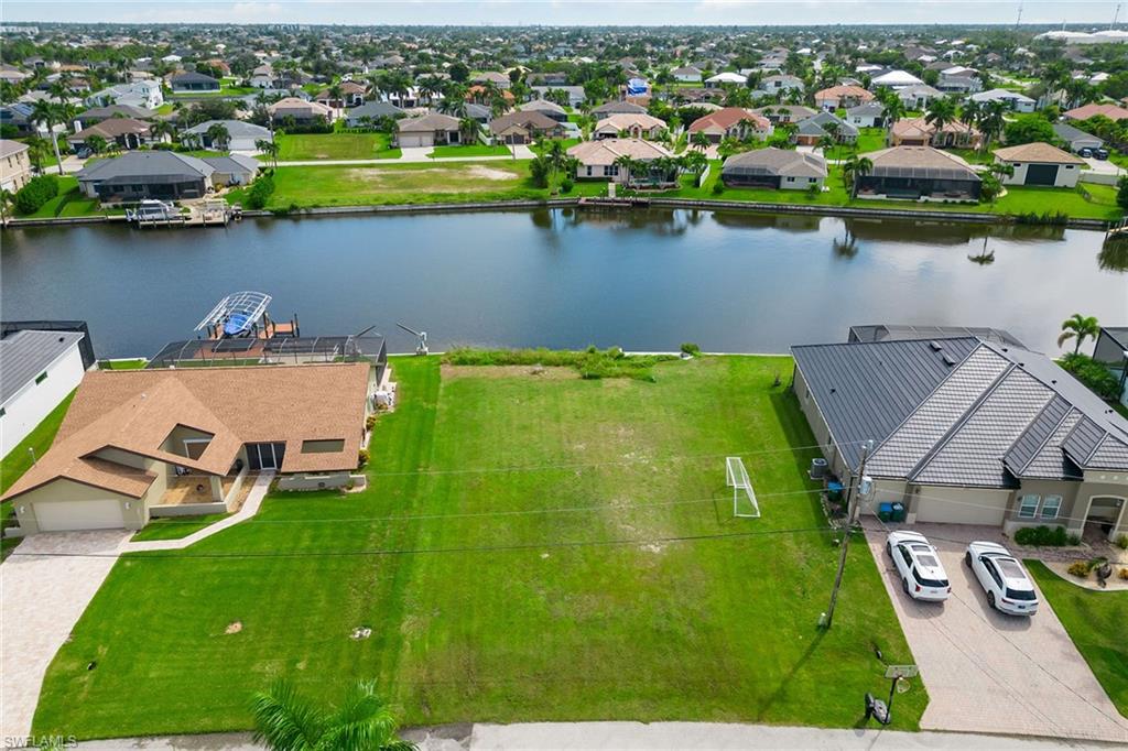 an aerial view of a house with a lake view