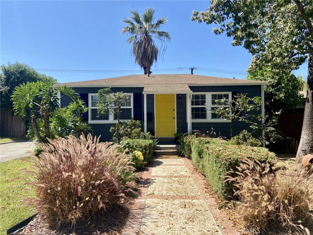 front view of a house with a large window